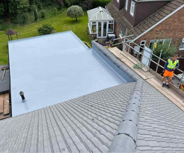 This is a photo of a newly installed hip roof, with a combined liquid covered flat roof. Work carried out by FDC Roofing Finedon