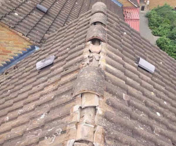 This is a photo if a roof ridge which has missing tiles. The ridge tiles are being replaced by FDC Roofing Finedon